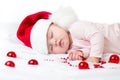 Adorable sleeping newborn baby wearing Santa Claus hat. Christmas, New Year holidays Royalty Free Stock Photo
