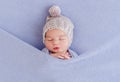 Adorable sleeping newborn covered with blanket