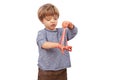 Adorable small boy playing with slime looks like red gunk Royalty Free Stock Photo