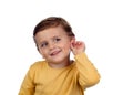 Adorable small child two years old touching his ear