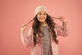 Adorable small child wear winter knitted accessory. Cute little girl fashion hat pink background. Clothes shop. Hats for Royalty Free Stock Photo