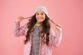 Adorable small child wear winter knitted accessory. Cute little girl fashion hat pink background. Clothes shop. Hats for Royalty Free Stock Photo