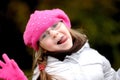 Adorable small girl in bright pink hat