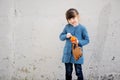 Adorable small girl with tangerine