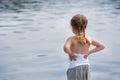 Adorable small girl thoughtfully looking on the river Royalty Free Stock Photo