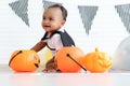 Adorable smiling African baby kid dressing up in vampire fancy Halloween costume with black bat wings, cheerful little cute child Royalty Free Stock Photo