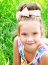 Adorable smiling little girl on the meadow Royalty Free Stock Photo