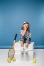 adorable smiling little girl with tennis raquet