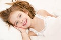 Adorable smiling little girl waked up