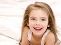 Adorable smiling little girl waked up