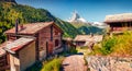 Adorable summer morning in Zermatt village with Matterhorn Monte Cervino, Mont Cervin peak on backgroud. Royalty Free Stock Photo