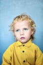 Adorable sweet little boy with golden hair and blue eyes Royalty Free Stock Photo