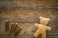 Adorable teddy bear on wooden table