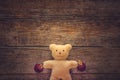 Adorable teddy bear on wooden table