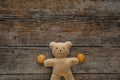 Adorable teddy bear on wooden table