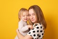 Adorable teen girl holding her new baby girl sister. Kids with large age gap. Big age difference between siblings Royalty Free Stock Photo