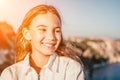 Adorable teenage girl outdoors enjoying sunset at beach on summer day. Close up portrait of smiling young romantic Royalty Free Stock Photo