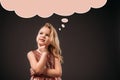 adorable thoughtful child in pink dress