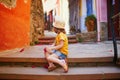 Adorable three years old girl sitting on a street of beautiful Mediterranean town Collioure in France Royalty Free Stock Photo