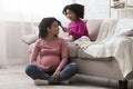 Adorable Toddler Black Girl Combing Hair Of Her Happy Pregnant Mom Royalty Free Stock Photo