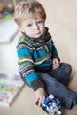 Adorable toddler with blue eyes indoor Royalty Free Stock Photo