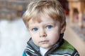 Adorable toddler with blue eyes indoor Royalty Free Stock Photo