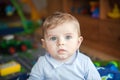 Adorable toddler with blue eyes indoor Royalty Free Stock Photo