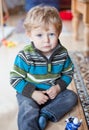 Adorable toddler with blue eyes indoor Royalty Free Stock Photo