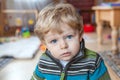 Adorable toddler with blue eyes indoor Royalty Free Stock Photo