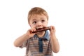 Adorable toddler boy eating a big chocolate bar Royalty Free Stock Photo