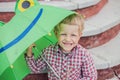 Adorable toddler boy with green frog umbrella Royalty Free Stock Photo