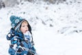 Adorable toddler boy having fun with snow on winter day Royalty Free Stock Photo