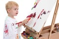 Adorable Toddler Boy Painting at Easel