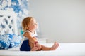 Adorable toddler girl in bedroom