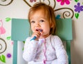 Adorable Toddler Girl Brushes Her Teeth in Pajamas. Health Care concept. Royalty Free Stock Photo