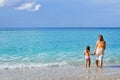 Adorable toddler girl enjoying her summer vacation at beach with Royalty Free Stock Photo