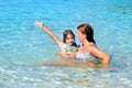 Adorable toddler girl enjoying her summer vacation at beach with Royalty Free Stock Photo