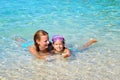 Adorable toddler girl enjoying her summer vacation at beach with Royalty Free Stock Photo