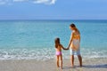 Adorable toddler girl enjoying her summer vacation at beach with Royalty Free Stock Photo