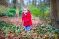 Adorable toddler girl with first snowdrop flowers Royalty Free Stock Photo