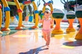 Adorable toddler girl having fun in aquapark. Enjoying day trip to an aqua amusement park Royalty Free Stock Photo