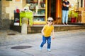 Adorable toddler girl having fun on a street of medieval town of Quimper  Brittany  France Royalty Free Stock Photo