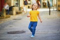 Adorable toddler girl having fun on a street of medieval town of Quimper  Brittany  France Royalty Free Stock Photo