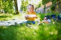 Adorable toddler girl having picnic in countryside on a summer day Royalty Free Stock Photo