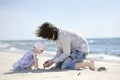 Adorable toddler girl and her father on a beach Royalty Free Stock Photo