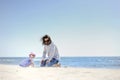 Adorable toddler girl and her father on a beach Royalty Free Stock Photo