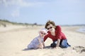 Adorable toddler girl and her mother on a beach Royalty Free Stock Photo