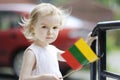 Adorable toddler girl with lithuanian flag