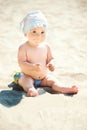 Adorable toddler girl playing on white sand beach Royalty Free Stock Photo