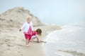 Adorable toddler girl on a sandy beach Royalty Free Stock Photo